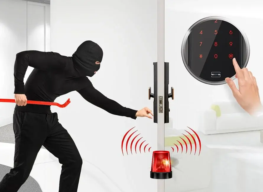 Illustration: a figure forcing a door on one side of a wall while a keypad and siren respond on the other.